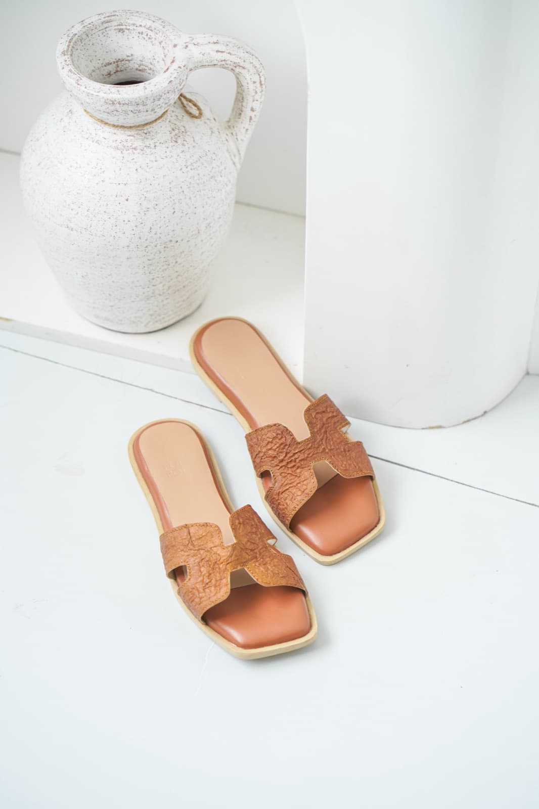 Symbia bioleather sandals on steps