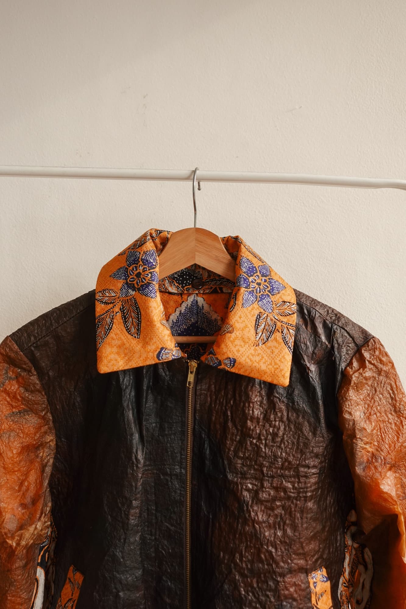 A Symbia jacket with a blue batik collar