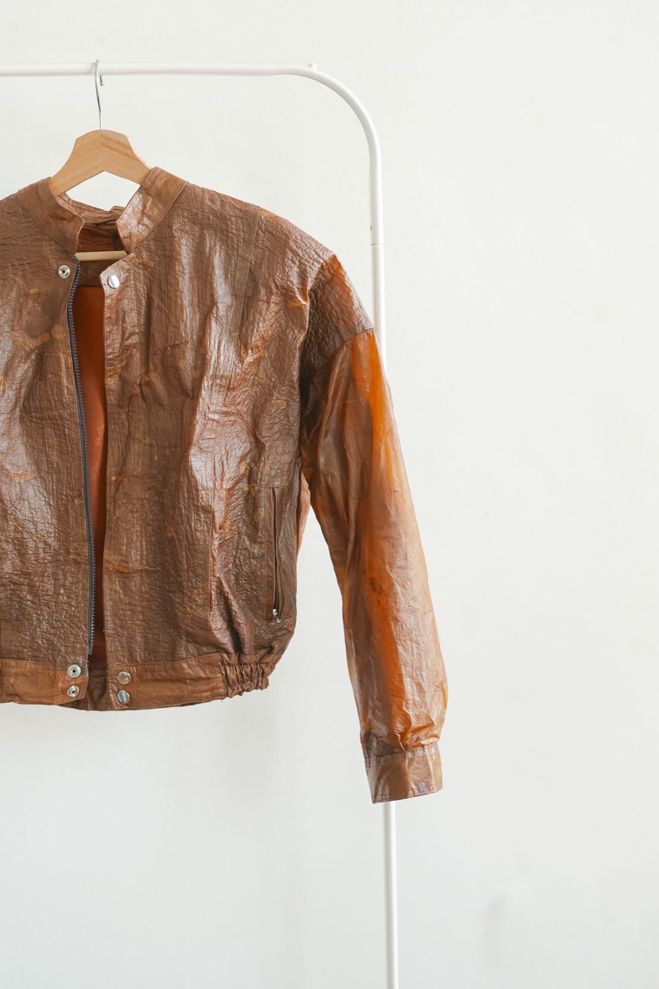 A Symbia bioleather jacket on a rack