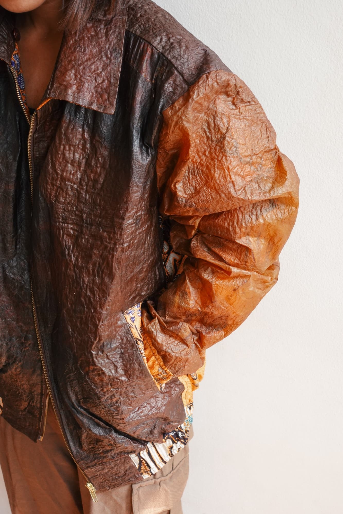 A model wearing a Symbia bioleather jacket, side