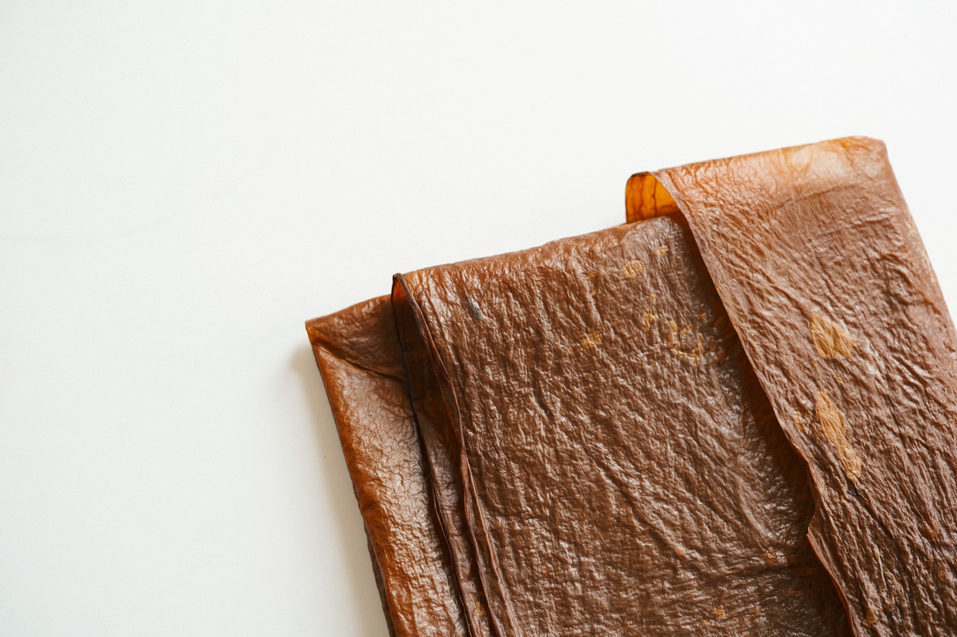 Finished sheets of bioleather folded in a stack